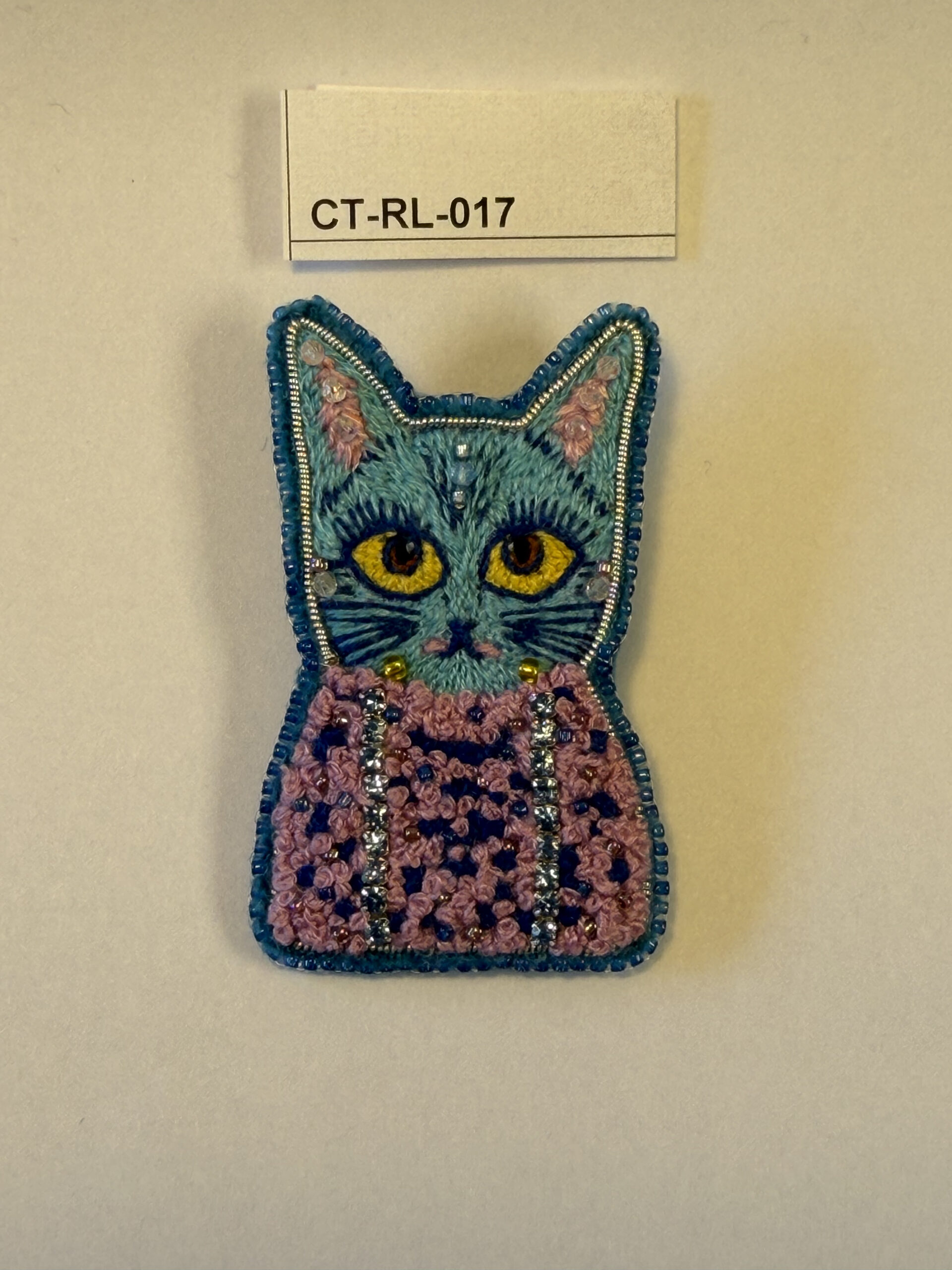 Blue Cat Brooch – Hand Embroidered Satin Stitch Face, Pink Knotted Body Pin — view 1