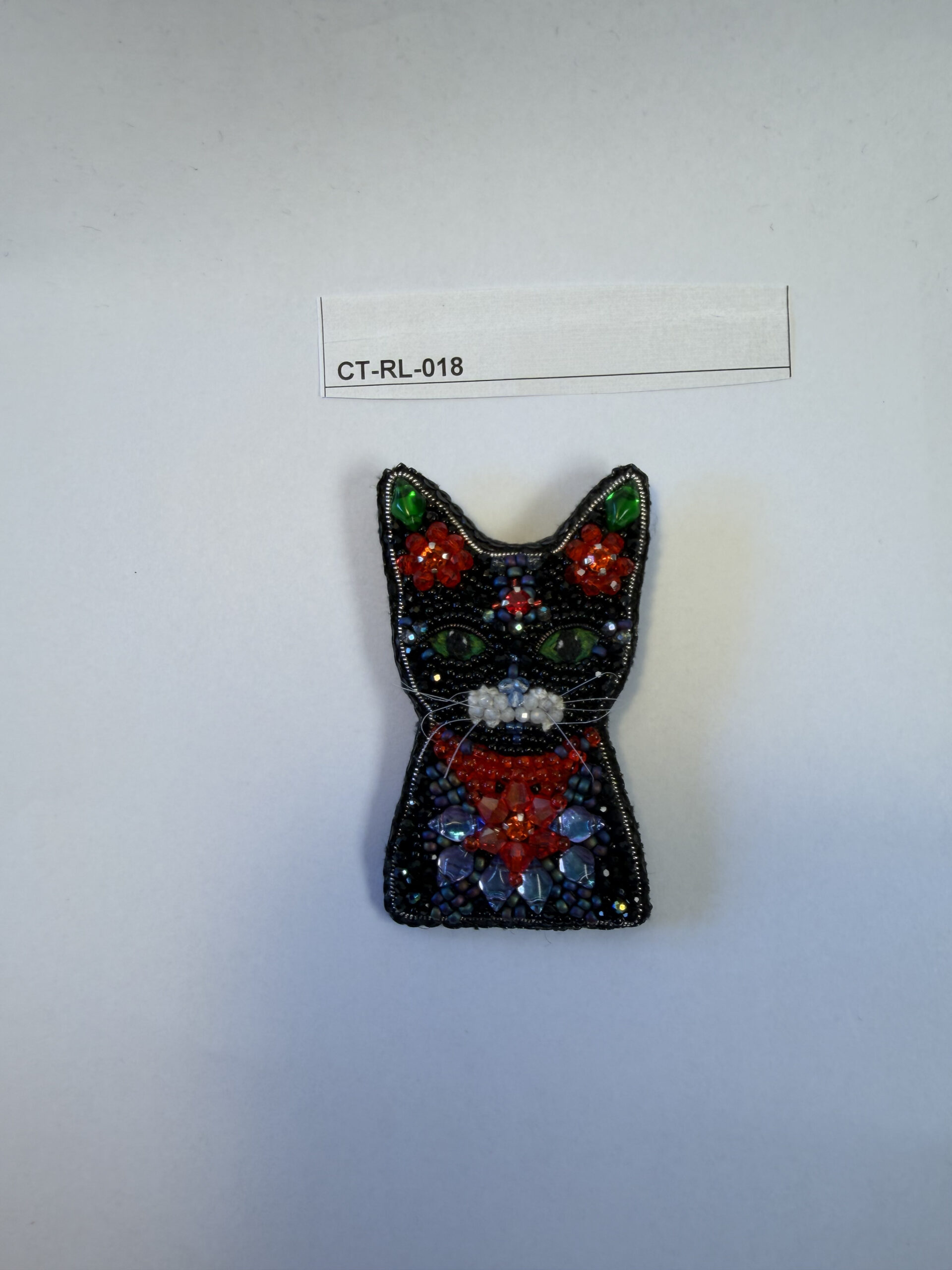 Black Cat Brooch with Red Crystal Flowers – Hand Embroidered Green Eyed Pin — view 1