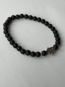Matte Black Hamsa Bracelet for Men, 6 mm Stretch Bead Bracelet — lifestyle photo