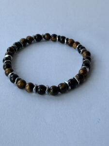 Brown and Black Beaded Bracelet for Men, 6 mm Stretch with Metallic-Color Spacers — lifestyle photo