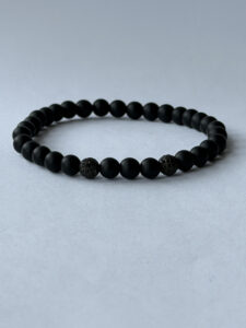 Matte Black Stretch Bracelet for Men, 6 mm Beads, Two Black Pavé Accents — lifestyle photo