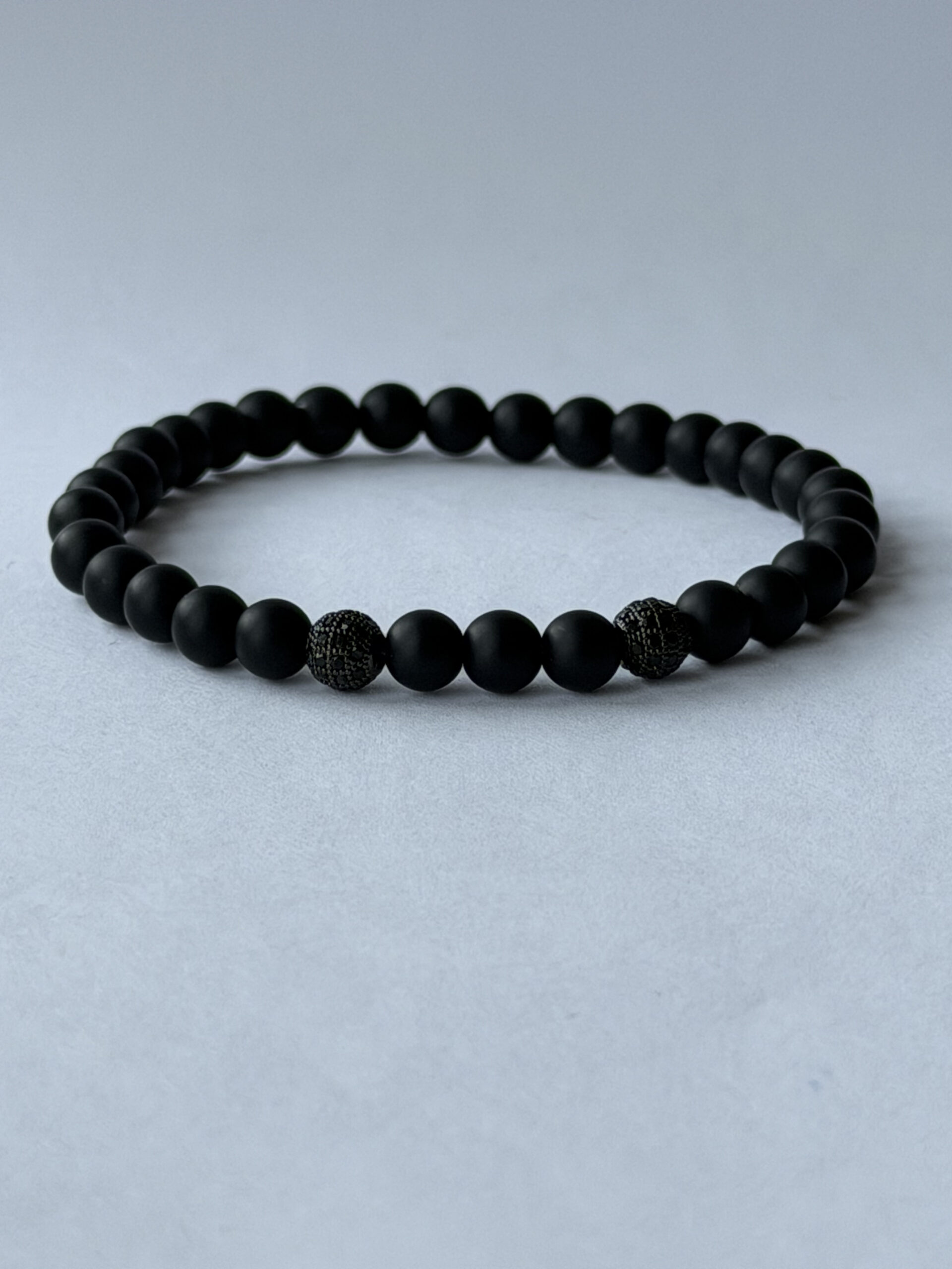 Matte Black Stretch Bracelet for Men, 6 mm Beads, Two Black Pavé Accents — featured image