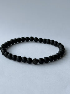 Matte Black Stretch Bracelet for Men, 6 mm Beads, Single Black Pavé Accent — lifestyle photo