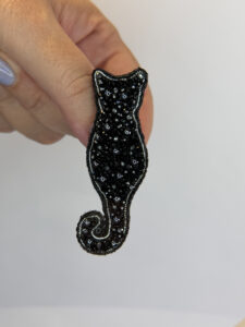 Black Sparkle Cat Silhouette Brooch – Hand Embroidered faceted beads Pin — lifestyle photo