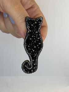 Black Faceted-Bead Cat Brooch – Hand-Embroidered Sitting Silhouette Pin — lifestyle photo