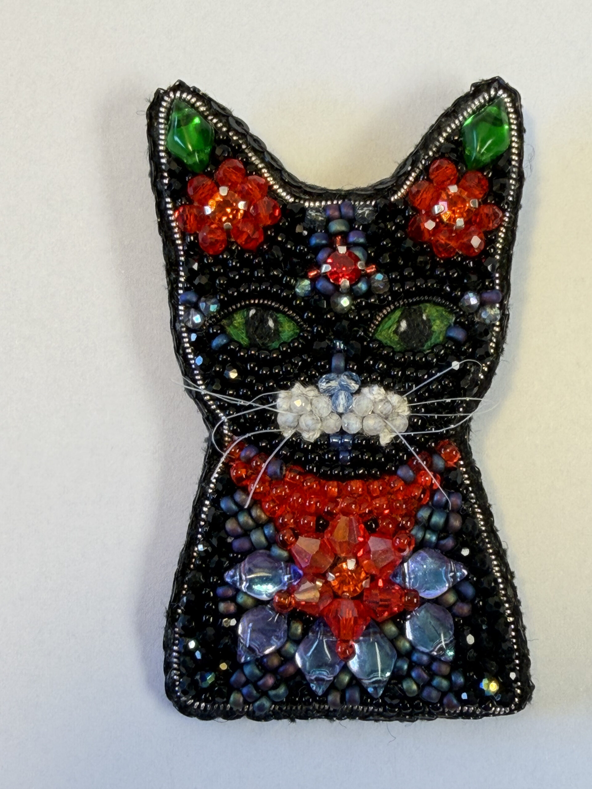 Black Cat Brooch with Red Crystal Flowers – Hand Embroidered Green Eyed Pin — featured image